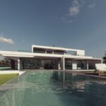 Front exterior of a modern 5-bedroom luxury villa with heated pool and sea views in Carvoeiro, Algarve